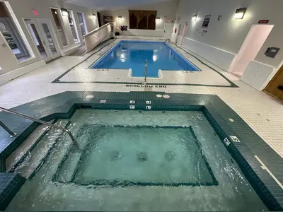 a large swimming pool in a building at Banff Gate Mountain Resort in Canmore