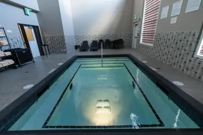 a swimming pool in a room with at Super 8 by Wyndham Canmore in Canmore