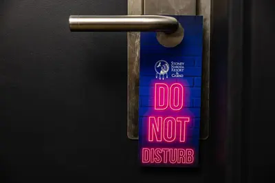 a sign on a door that says do not disturb at Stoney Nakoda Resort & Casino in Seebe