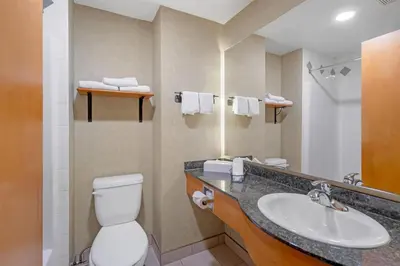 a bathroom with a toilet and a sink at Best Western Plus Valemount Inn & Suites in Valemount