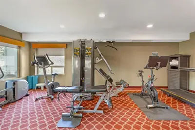 a gym with two treadmills and two exercise bikes at Best Western Plus Valemount Inn & Suites in Valemount