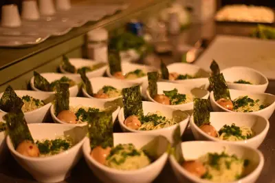 a buffet filled with dishes of food with broccoli at Inn on the Lake - Whitehorse in Marsh Lake