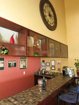 a kitchen with a large clock on the wall at A View of the Lake B & B in West Kelowna
