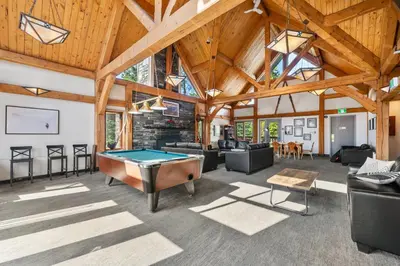 a large room with a pool table in it at HI Lake Louise Alpine Centre - Hostel in Lake Louise