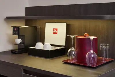 a counter with two wine glasses and a box at Varscona Hotel on Whyte in Edmonton