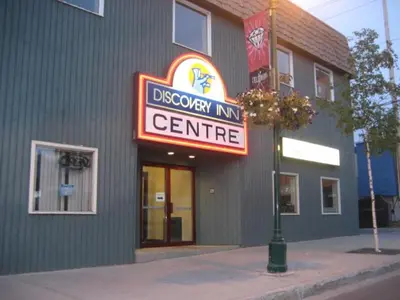 a building with a sign that reads discovery inn center at Discovery Inn in Yellowknife
