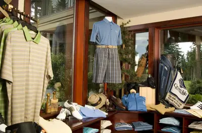a store window with clothes and shoes on display at Crown Isle Resort & Golf Community in Courtenay