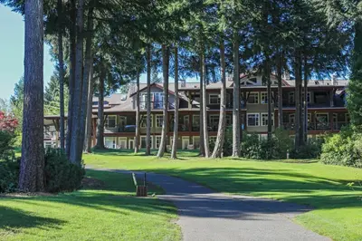 a large building with trees in front of it at Crown Isle Resort & Golf Community in Courtenay