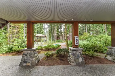 a pavilion with a building with a sign on it at Crown Isle Resort & Golf Community in Courtenay