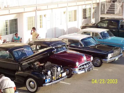 a group of old cars parked in a parking lot at Model A Inn in Cranbrook