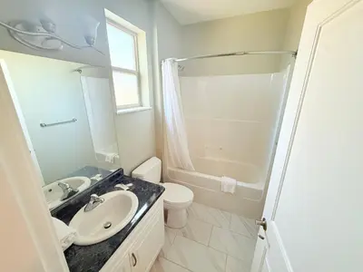 a bathroom with a sink and a toilet and a shower at Super 8 by Wyndham Salmon Arm in Salmon Arm