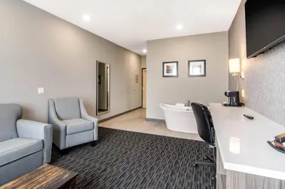a dental office with chairs and a desk and a tub at Comfort Inn & Suites in North Battleford