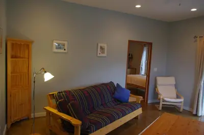 a living room with a couch and a chair at Baergnaescht B&B in Osoyoos