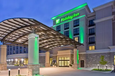 a hotel with a building with a green light at Holiday Inn Hotel & Suites Red Deer by IHG in Red Deer