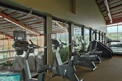 a gym with treadmills and ellipticals in a building at River Rock Casino Hotel in Richmond