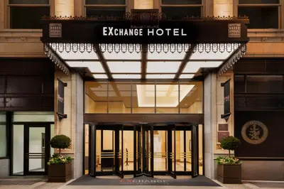 a facade of an entrance to an apartment hotel at EXchange Hotel Vancouver in Vancouver