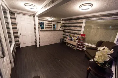 a living room with a striped wall at Olympia Lodge in Calgary