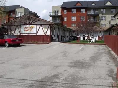 an empty parking lot in front of a building at Sunset Motel in Radium Hot Springs