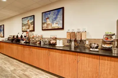 a bar in a restaurant with a counter at Canalta Jurassic - Drumheller in Drumheller