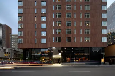 a tall building with a street in front of it at Hotel Le Germain Calgary in Calgary