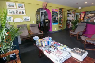 a store with a table with books on it at Ocean Island Inn | Backpackers | Suites in Victoria