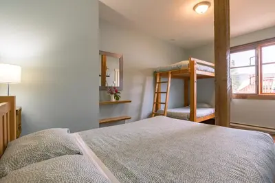 a bedroom with a bunk bed and a ladder at Riding Fool Accommodation in Cumberland