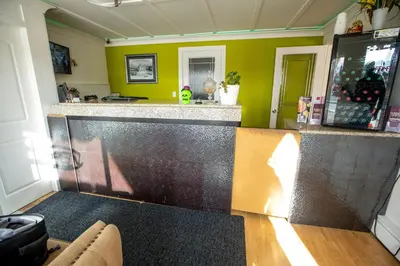 a bar in a room with a counter top at Camrose Motel in Camrose