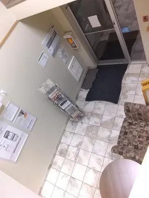 an overhead view of a kitchen with a table and chairs at Econo Lodge in Okotoks