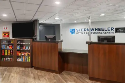 a sign for a starwelliger emergency room with a television at Sternwheeler Hotel & Conference Centre, Trademark by Wyndham in Whitehorse