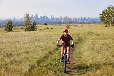 a man riding a bike down a field at Courtyard by Marriott Calgary Airport in Calgary