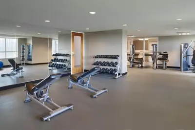 a gym with cardio equipment and treadmills at Residence Inn by Marriott Calgary Airport in Calgary