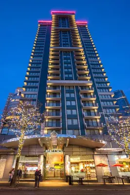 a tall building with christmas lights in front of it at Blue Horizon Hotel in Vancouver
