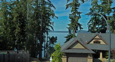 a house with a view of a lake at Eagle Rock Bed and Breakfast in Chemainus