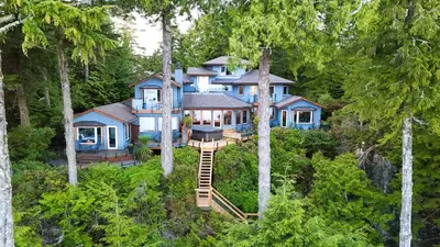an aerial view of a house in the woods at Snug Harbour Inn in Ucluelet