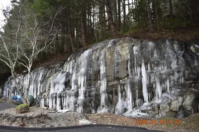 a waterfall on the side of a rock at High Point Resort in Quathiaski Cove