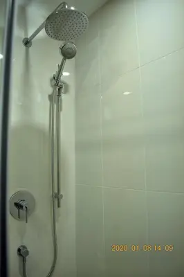 a shower with a shower head in a bathroom at High Point Resort in Quathiaski Cove