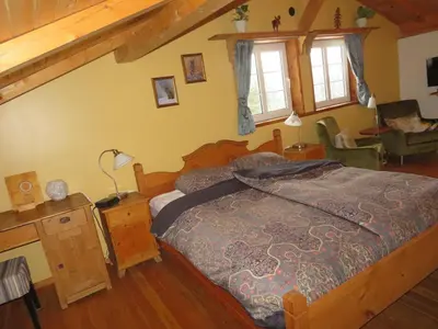 a bedroom with a large bed in a house at Alpenglow Bed and Breakfast in Kimberley