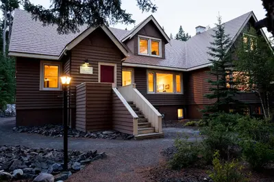 a house with a staircase in front of it at Banff Boutique Inn - Adults only in Banff