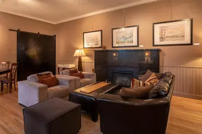 a living room with a couch and a fireplace at Banff Boutique Inn - Adults only in Banff