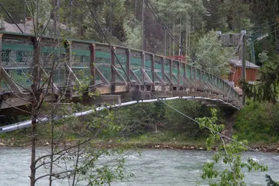 a bridge over a river with a train on it at Panorama Vacation Retreat at Horsethief Lodge in Panorama