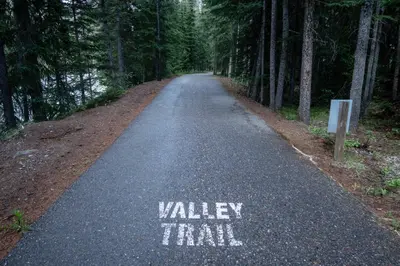 a road with the words valley trail painted on it at Panorama Vacation Retreat at Horsethief Lodge in Panorama