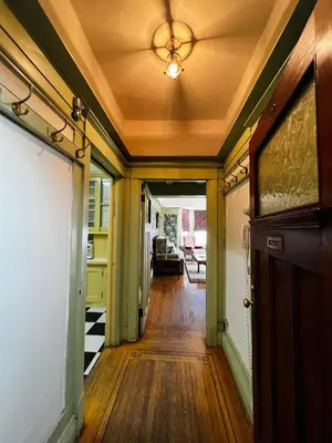 a hallway of a house with a ceiling at Arundel Mansions Hotel in New Westminster