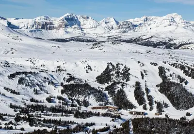 a ski lodge in the middle of a snow covered mountain at Sunshine Mountain Lodge in Banff