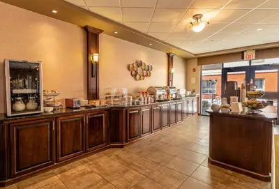 a restaurant with a buffet line in a room at The Kanata Fort Saskatchewan in Fort Saskatchewan
