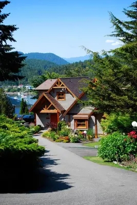 a house on a street with a driveway at Sunshine Coast Resort in Madeira Park
