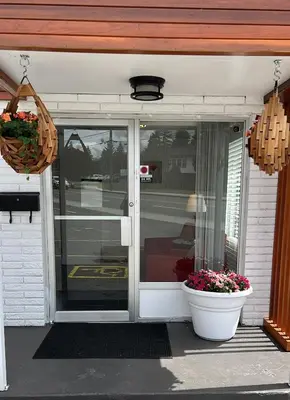 a front door of a house with a flower pot at The Spot in Nanaimo