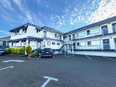 a parking lot in front of a large building at Buccaneer Inn in Nanaimo