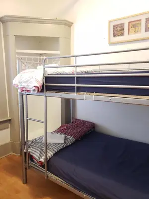 a bunk bed room with two bunk beds in a room at St Clair Hostel in Vancouver