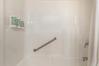 a bathroom with a shower with a shower curtain at Best Western Sicamous Inn in Sicamous