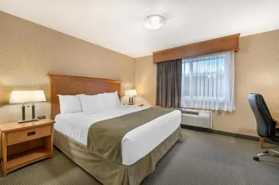 a hotel room with a bed and a window at Best Western Sicamous Inn in Sicamous